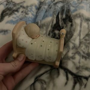 Precious moments kid in bed statue